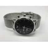 A gents Armani connect watch with black face and subsidiary dial.