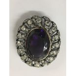 An Fine antique brooch with large central amethyst