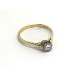 An 18carat gold diamond solitaire ring. 0.20 of a