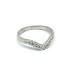 An 18carat white gold wishbone shape ring set with