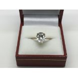 A 9ct gold ring set with a large pear shaped CZ st