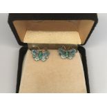 A pair of silver enamel butterfly earrings