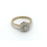 A 9ct gold seven stone diamond ring of flowerhead