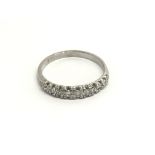 An 18carat gold ring a half hoop eternity ring set