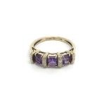 A 9ct white gold amethyst and diamond ring, (M.5),