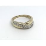 A 9ct gold and diamond ring, (P), 3.7g.