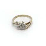 A 9carat gold ring set with a a floral pattern of