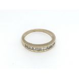 A 9ct gold ring set with baguette cut diamonds, ap
