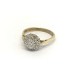 An 18carat gold ring set with a pattern of diamond
