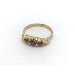 A circa 1920s 18ct gold ring set with three rubies