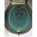 An antique 15 ct pendant set with aquamarine stone