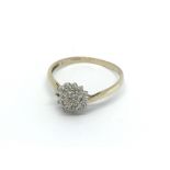 A 9ct gold diamond cluster ring (one stone missing