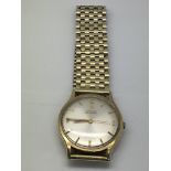 A 9ct gold Omega automatic watch with champagne di