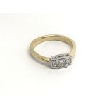 An18cart gold ring set with three princes cut diam