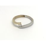 An 18carat white and yellow gold ring set with a b