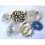 A collection of vintage glass and shell bead neckl