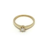 An 18carat gold ring set with a solitaire diamond