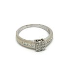 An 18carat gold ring set with a square pattern of