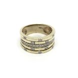 A modern design 9carat gold ring set with diamonds