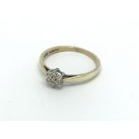 A 9ct gold seven stone diamond ring in the form of