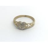 A 9carat gold ring set with a heart pattern of dia