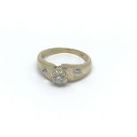 A 9carat gold ring set with a central diamond the