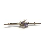 An antique 9ct gold and Amethyst brooch having spi