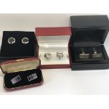 Four pairs of cufflinks including a pair of silver