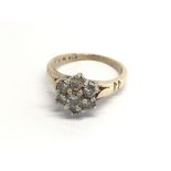 A 9carat gold ring set with a pattern of rose cut