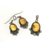 An Arts & Crafts silver and amber jewellery set co