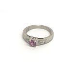 An 18carat gold ring set with a pink sapphire and diamonds ring size L
