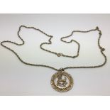 A 9ct gold pendant of a ram on a 9ct gold necklace