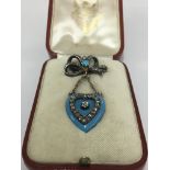 A Victorian brooch in the form of a bow and enamel