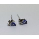 A pair of white gold diamond and tanzanite st