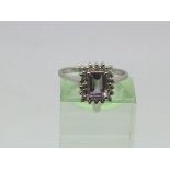 A 9ct white gold ring set with an amethyst, approx