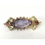 A antique brooch inset with amethyst and garnet 3