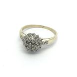 A 9ct gold five point diamond cluster ring, approx