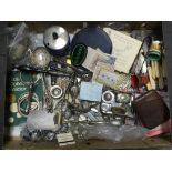 A box of mixed items including vestas, cutlery etc