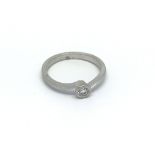 A platinum solitaire diamond ring ring marked 950,