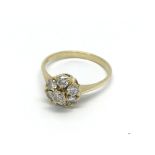 An 18carat gold ring set with a circular pattern o