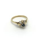 An 18carat gold ring set with a flower pattern wit