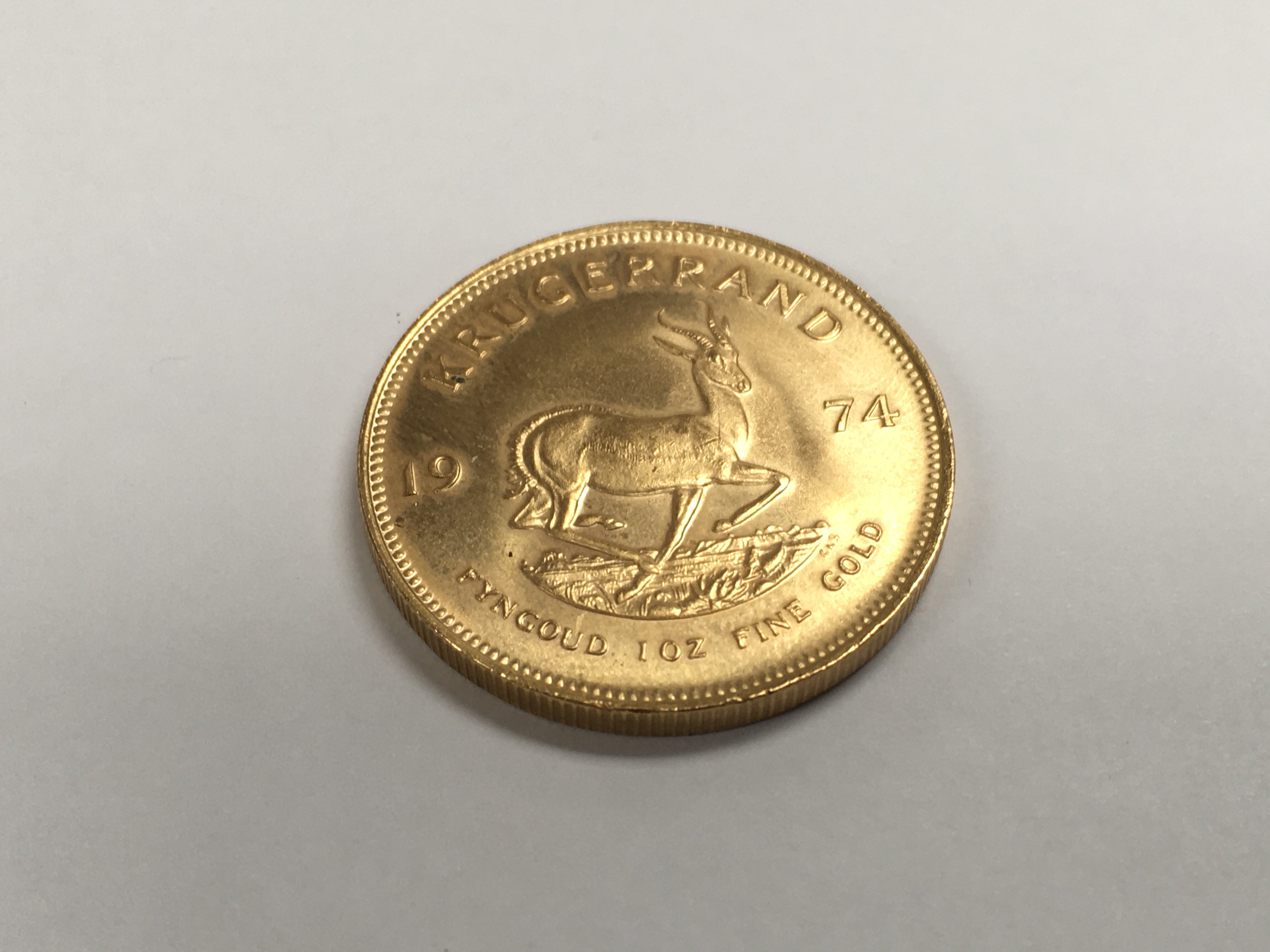 A 1974 1 oz gold krugerrand.