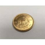 A 1974 1 oz gold krugerrand.