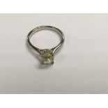A 18ct white gold 1.75ct yellow diamond solitaire ring, size K.