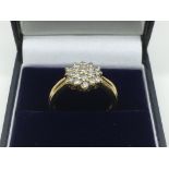 An 18ct gold 0.50ct diamond cluster ring, approx 4.6g and approx size O.