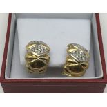 A pair of heavy 18ct gold earrings set with diamon