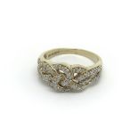 A decorative 9carat gold ring set with a woven pat