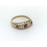 A circa 1920s 18ct gold ring set with three rubies