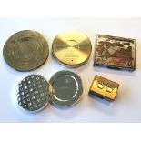 A collection of various compacts together with a T