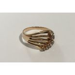 A heavy 14ct gold and diamond set ring. Approx 4.6